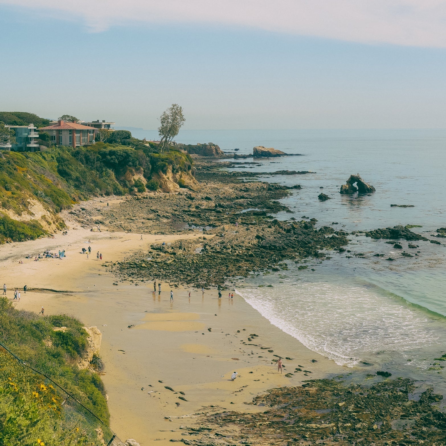 Coastal scene with rocky outcroppings, tide pools, and a seaside cliff. Effortless, classic seaside lifestyle depicted, capturing fun, high-end leisure at Metrobazaarstore.
