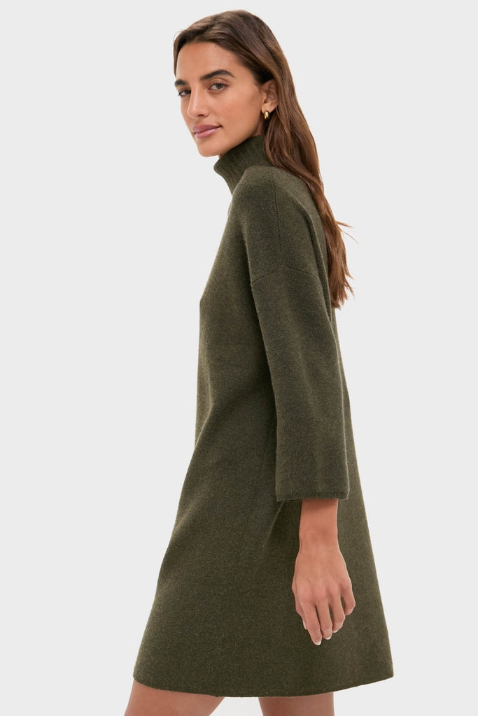 Model wearing the classic Moss Green Vivianne Dress, an effortless knit turtleneck sweater dress with three-quarter sleeves, perfect for fun, high-end cold-weather outings.