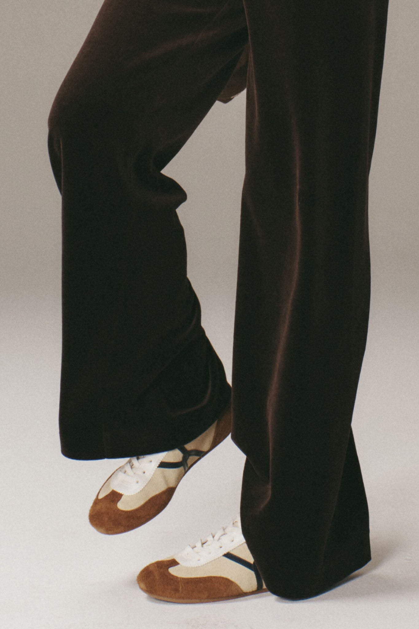 Classic Sand and Hazelwood Riviera Sneakers with suede overlays and a padded collar, captured mid-step for an effortless, high-end, fun style. Perfect for on-the-go days.