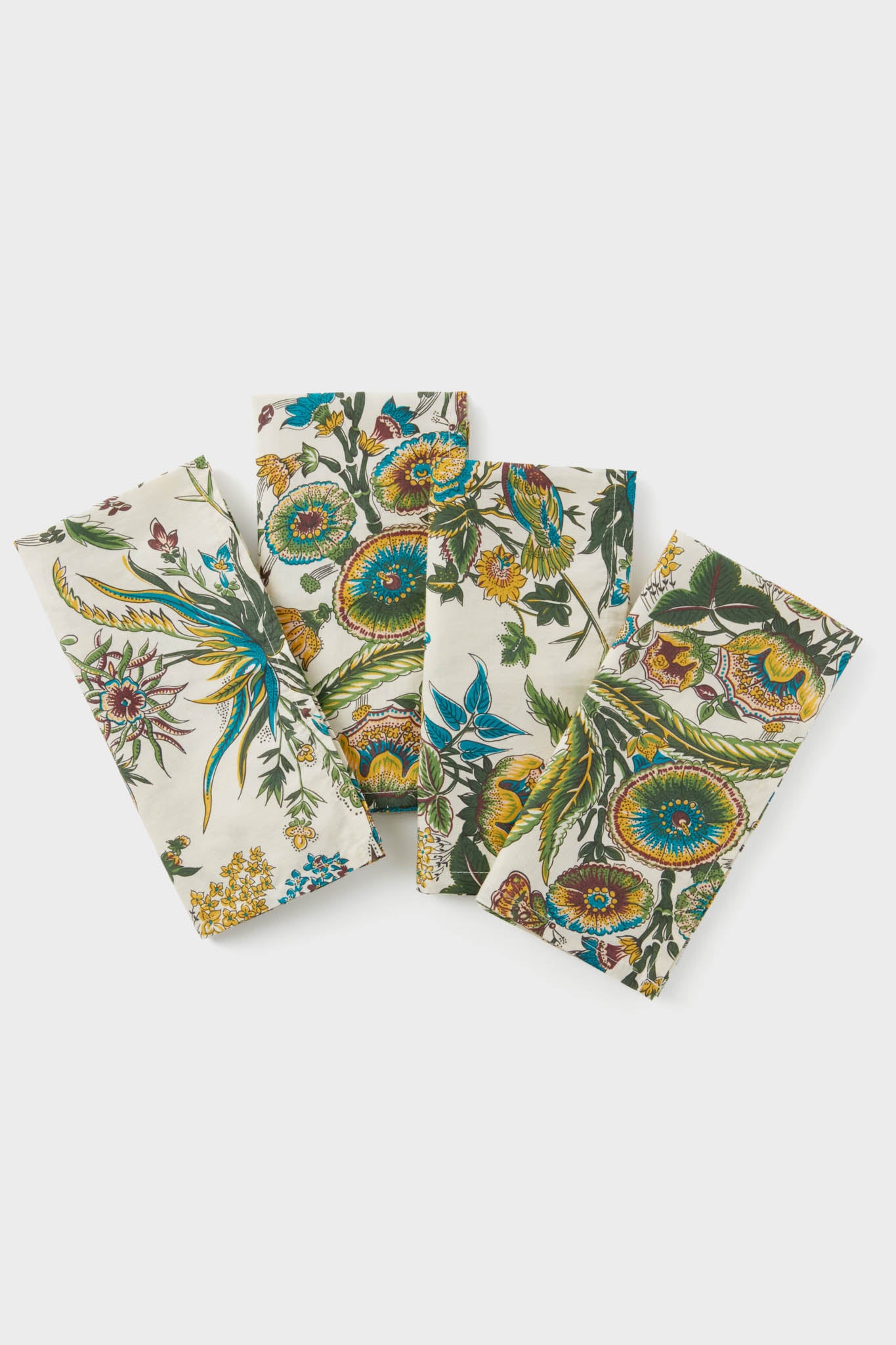 Set of 4 cotton napkins by Metrobazaarstore Home, featuring a colorful floral and botanical print in a staggered layout. Perfect as stylish table linens for any occasion.